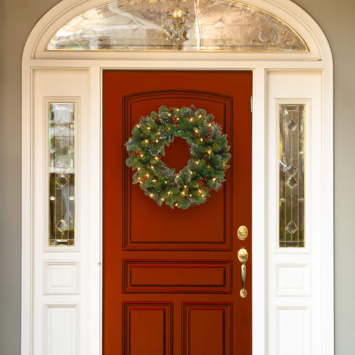 National Tree Company 24 in Pre-Lit Crestwood Spruce Artificial Christmas Wreath, Christmas Decoration with Glitter, Pinecones, Red Berries, 50 Clear Lights, 160 Tips, Green
